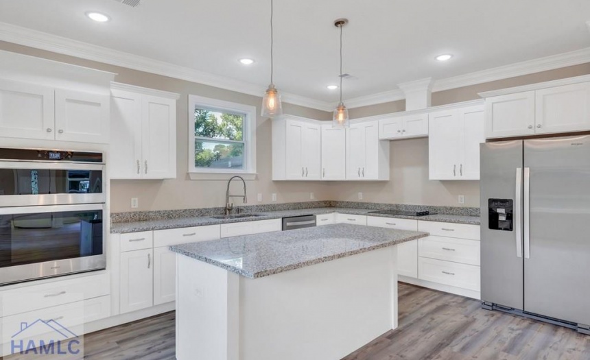 Open Concept Kitchen with an Island & Granite Coun