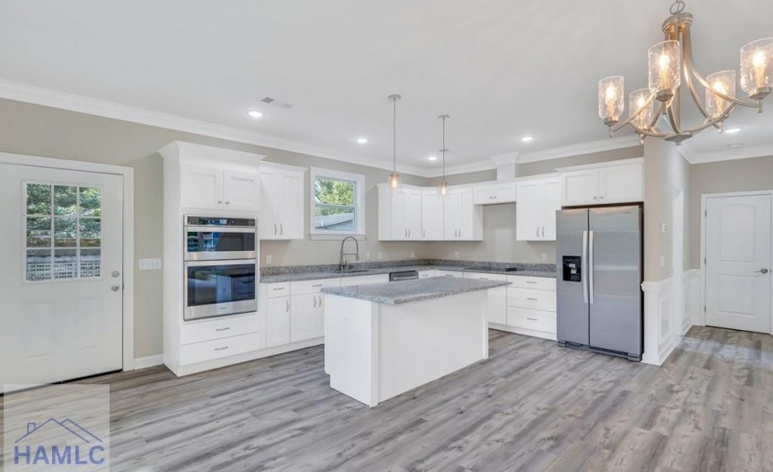 Open Concept Kitchen with an Island & Granite Coun