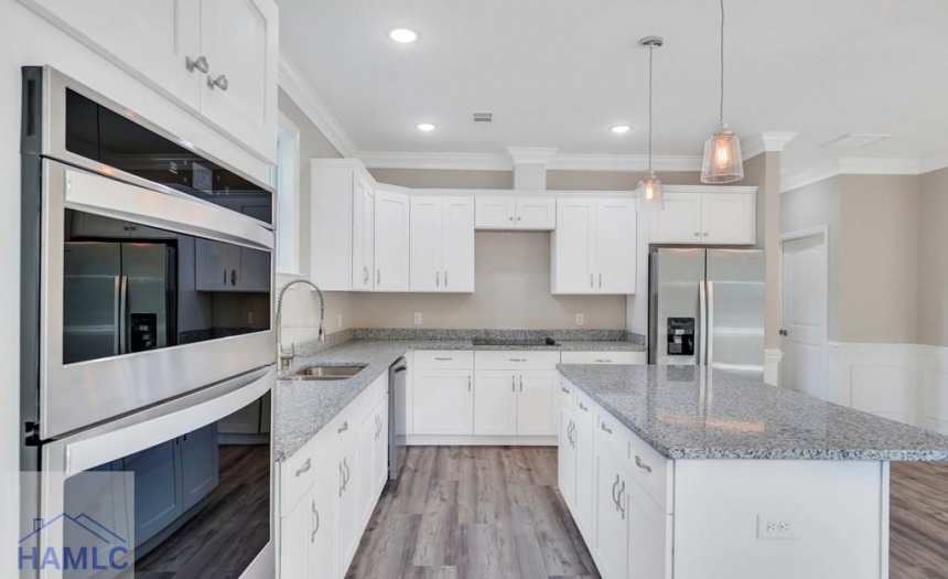 Open Concept Kitchen with an Island & Granite Coun