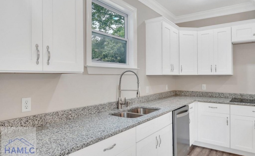 Open Concept Kitchen with an Island & Granite Coun