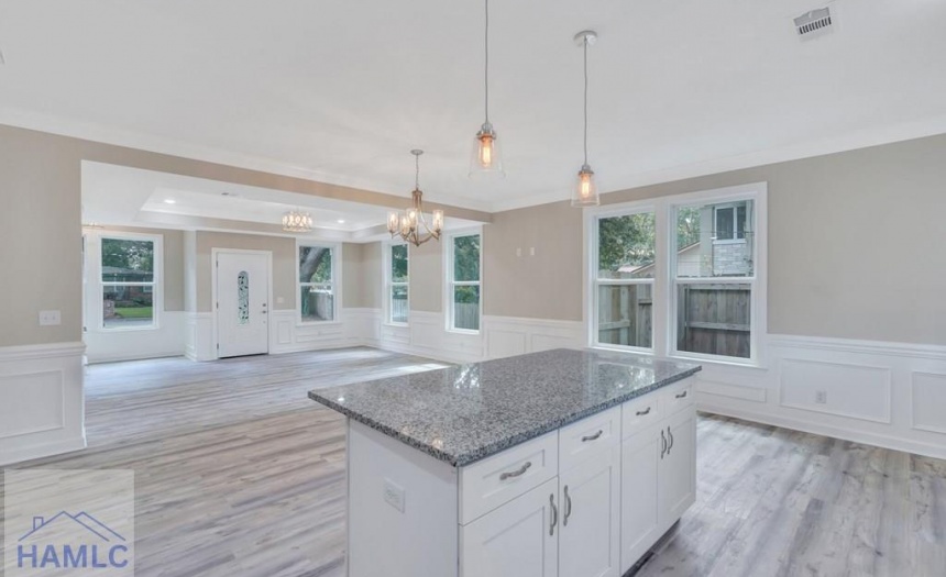 Open Concept Kitchen with an Island & Granite Coun