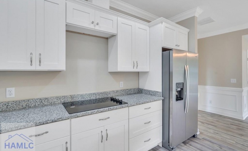 Open Concept Kitchen with an Island & Granite Coun