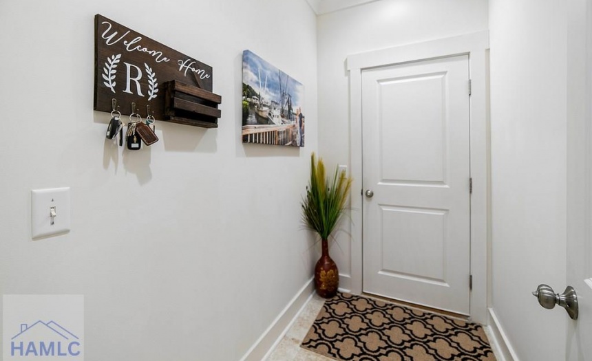 Door leading to 2 car garage