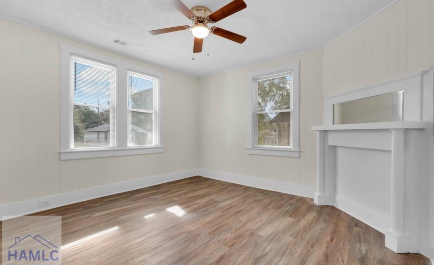 Spacious Living Room with decorative fireplace